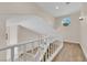 Bright staircase with white railing and wood-look flooring leading to the upper level at 5205 Coral Glow Ct, Las Vegas, NV 89149