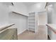 Bright walk-in closet with shelves and hanging racks, offering ample storage space at 5205 Coral Glow Ct, Las Vegas, NV 89149