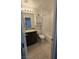 Bathroom with a toilet, vanity with granite counters, and tiled floors at 5209 Silica Chalk Ave, Las Vegas, NV 89115