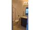 Clean bathroom featuring a vanity, toilet, and shower with neutral tile at 5209 Silica Chalk Ave, Las Vegas, NV 89115
