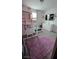 Bright bedroom featuring bunk beds, a television, and a light purple rug at 5209 Silica Chalk Ave, Las Vegas, NV 89115