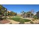 Lush community space with a grassy lawn, gazebo, trees and desert landscaping at 5209 Silica Chalk Ave, Las Vegas, NV 89115