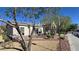 Home exterior with desert landscaping and neutral color palette at 5209 Silica Chalk Ave, Las Vegas, NV 89115