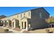Exterior shot of a two-story townhome featuring neutral tones and well-maintained landscaping at 5209 Silica Chalk Ave, Las Vegas, NV 89115