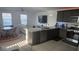 Bright, open-concept kitchen with granite countertops, stainless appliances, and adjacent living space at 5209 Silica Chalk Ave, Las Vegas, NV 89115