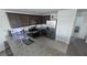 A functional kitchen with granite countertops, stainless steel appliances, and tile flooring at 5209 Silica Chalk Ave, Las Vegas, NV 89115