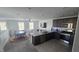 Bright, open living area with a kitchen featuring granite countertops and stainless appliances at 5209 Silica Chalk Ave, Las Vegas, NV 89115