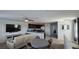 Open-concept living space featuring a kitchen with dark wood cabinets and stainless steel appliances at 5209 Silica Chalk Ave, Las Vegas, NV 89115