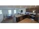 Bright open living and kitchen area with stainless appliances and a dining area at 5209 Silica Chalk Ave, Las Vegas, NV 89115