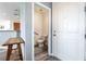 Well-lit half bathroom with modern fixtures, new floors, and convenient location by the front door at 6121 Mission Gorge Ct, Las Vegas, NV 89130