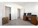 Neutral bedroom with closet, doorway, and desk, ready to be personalized at 6121 Mission Gorge Ct, Las Vegas, NV 89130