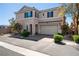 Inviting two-story home with a two-car garage and well-maintained landscaping, curb appeal at 6121 Mission Gorge Ct, Las Vegas, NV 89130