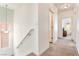 Upstairs hallway with carpet and natural light, with access to bedrooms and other living areas at 6121 Mission Gorge Ct, Las Vegas, NV 89130