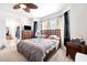 Spacious main bedroom with a queen-sized bed and large windows, an attached bathroom at 6121 Mission Gorge Ct, Las Vegas, NV 89130