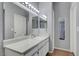 Modern bathroom with white cabinets, large mirror, and sleek fixtures at 6650 W Warm Springs Rd # 1083, Las Vegas, NV 89118