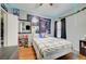 Cozy bedroom with hardwood floors, decorations, and a comfortable bed at 6650 W Warm Springs Rd # 1083, Las Vegas, NV 89118