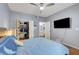 Cozy bedroom featuring wood-look floors, a ceiling fan, and an open closet at 6650 W Warm Springs Rd # 1083, Las Vegas, NV 89118