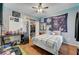 This bedroom features vinyl floors, a ceiling fan, string lights, and a closet at 6650 W Warm Springs Rd # 1083, Las Vegas, NV 89118