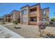 Two-story apartment complex features desert landscaping and private balconies at 6650 W Warm Springs Rd # 1083, Las Vegas, NV 89118