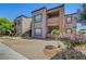 Two-story apartment complex features desert landscaping and private balconies at 6650 W Warm Springs Rd # 1083, Las Vegas, NV 89118