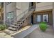 Exterior stairs leading to upper unit with railing and landing area at 6650 W Warm Springs Rd # 1083, Las Vegas, NV 89118