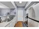 Updated kitchen with stainless steel appliances and white cabinetry at 6650 W Warm Springs Rd # 1083, Las Vegas, NV 89118