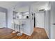 Kitchen bar with sleek stools and open view to the kitchen at 6650 W Warm Springs Rd # 1083, Las Vegas, NV 89118