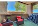 Cozy patio with outdoor seating and view of surrounding landscape at 6650 W Warm Springs Rd # 1083, Las Vegas, NV 89118