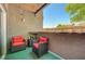 Relaxing patio area with outdoor chairs and a view of the neighborhood at 6650 W Warm Springs Rd # 1083, Las Vegas, NV 89118