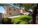 Backyard features a well-manicured lawn, mature trees, and a cozy patio, ideal for relaxing or entertaining outdoors at 682 E Sole Addiction Ave, Las Vegas, NV 89183