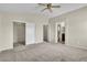 Bedroom with neutral walls, closet and bathroom access, and carpet at 682 E Sole Addiction Ave, Las Vegas, NV 89183