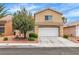 Charming two-story home featuring a tile roof, a spacious two-car garage, and mature landscaping at 682 E Sole Addiction Ave, Las Vegas, NV 89183