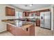 Modern kitchen with stainless steel appliances and granite countertops at 682 E Sole Addiction Ave, Las Vegas, NV 89183