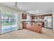 Bright kitchen with stainless steel appliances, a breakfast bar, and easy access to the patio at 682 E Sole Addiction Ave, Las Vegas, NV 89183