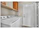 Convenient laundry room with side by side washer and dryer at 682 E Sole Addiction Ave, Las Vegas, NV 89183
