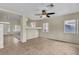 Open-concept living room area with stylish tile flooring, neutral walls, and bright lighting at 682 E Sole Addiction Ave, Las Vegas, NV 89183