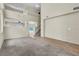 Spacious living room featuring a combination of tile and new carpet, high ceilings, and an open floorplan at 682 E Sole Addiction Ave, Las Vegas, NV 89183
