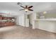 Open-concept living space with a breakfast bar and stainless steel appliances at 682 E Sole Addiction Ave, Las Vegas, NV 89183
