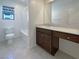 Bathroom featuring a shower-tub combo and a vanity with drawers at 6918 Dandelion Park Ave, Las Vegas, NV 89113