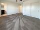 Large bedroom with carpet floors, closet space, and an ensuite bathroom at 6918 Dandelion Park Ave, Las Vegas, NV 89113