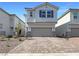 Charming two-story home featuring a two-car garage and beautiful brick driveway in a well-kept community at 6918 Dandelion Park Ave, Las Vegas, NV 89113