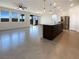Spacious open-concept living area with an island and stainless steel appliances at 6918 Dandelion Park Ave, Las Vegas, NV 89113