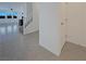 Inviting entrance with tile flooring that flows into an open living space and an open staircase at 6918 Dandelion Park Ave, Las Vegas, NV 89113
