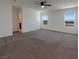 Spacious main bedroom featuring mountain views and neutral carpet flooring at 6918 Dandelion Park Ave, Las Vegas, NV 89113