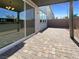 Covered brick patio with sliding glass doors leading to the home's interior at 6918 Dandelion Park Ave, Las Vegas, NV 89113