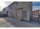 Enclosed backyard with a concrete patio and secure gated access at 7240 Wandering Star Ct, Las Vegas, NV 89131