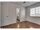 Bedroom with wood-look floors and a bathroom view at 7240 Wandering Star Ct, Las Vegas, NV 89131