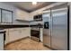 The kitchen features stainless steel appliances, white cabinets, and granite countertops at 7240 Wandering Star Ct, Las Vegas, NV 89131