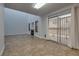 A well-lit room features access to an outdoor patio, and a cozy fireplace at 7240 Wandering Star Ct, Las Vegas, NV 89131