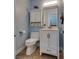 Cozy powder room with updated vanity, mirror, and fixtures at 7240 Wandering Star Ct, Las Vegas, NV 89131